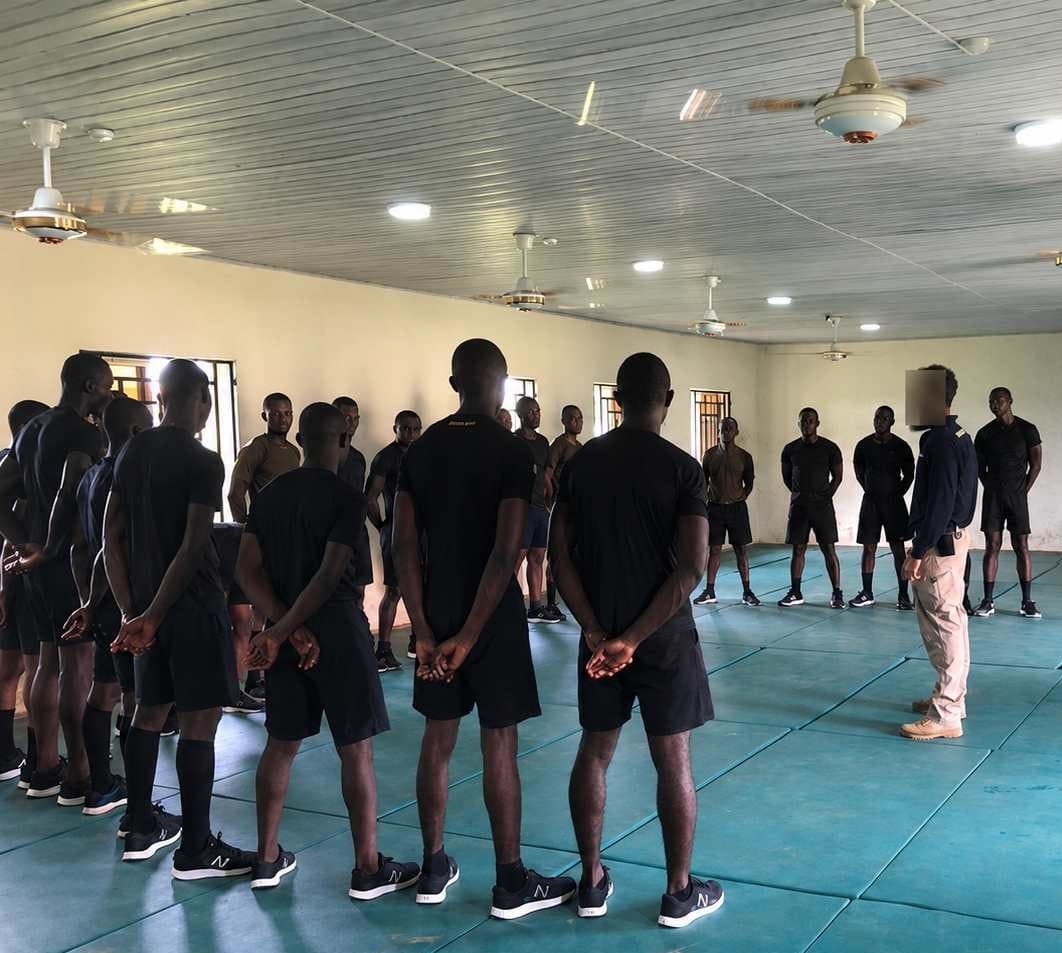 Israeli-led instructor training security personnel formed up in a hall