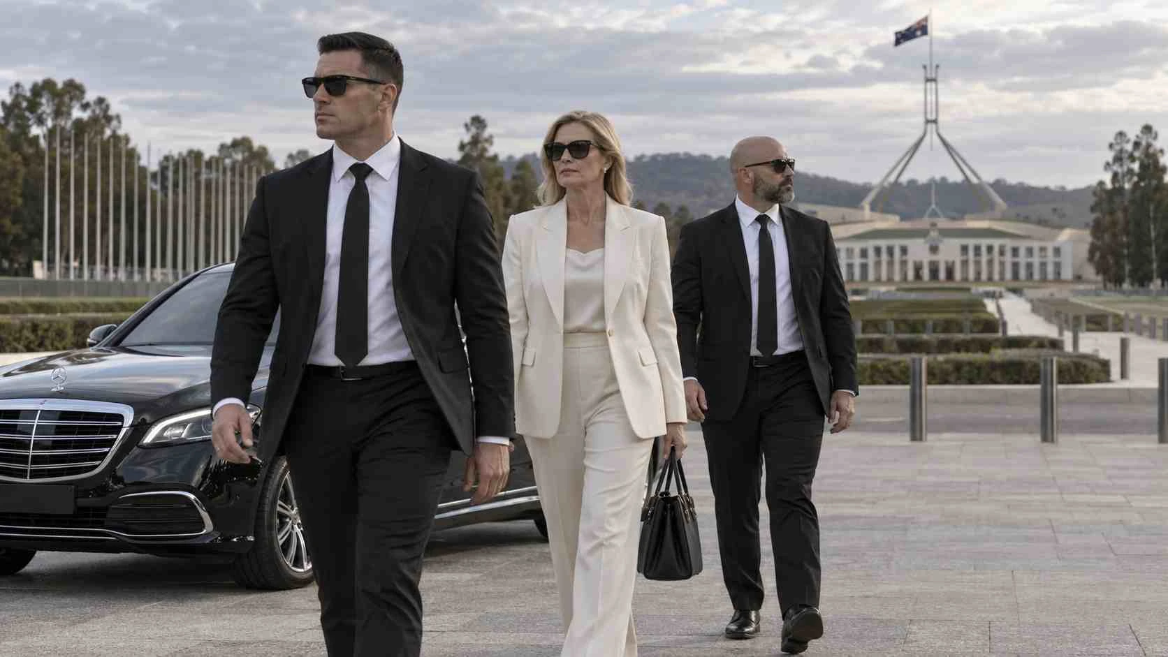 Executive protection bodyguards accompanying a diplomatic or private client in Canberra, Australia